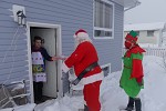 Santa Visiting a house with his Elf