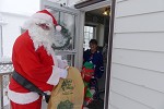 Santa is visiting a house with gifts