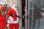 Santa and his elf at the door