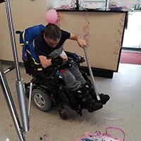 having fun at party with a pinata