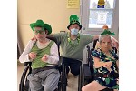 three people happy celebrating St. Patrick's Day together